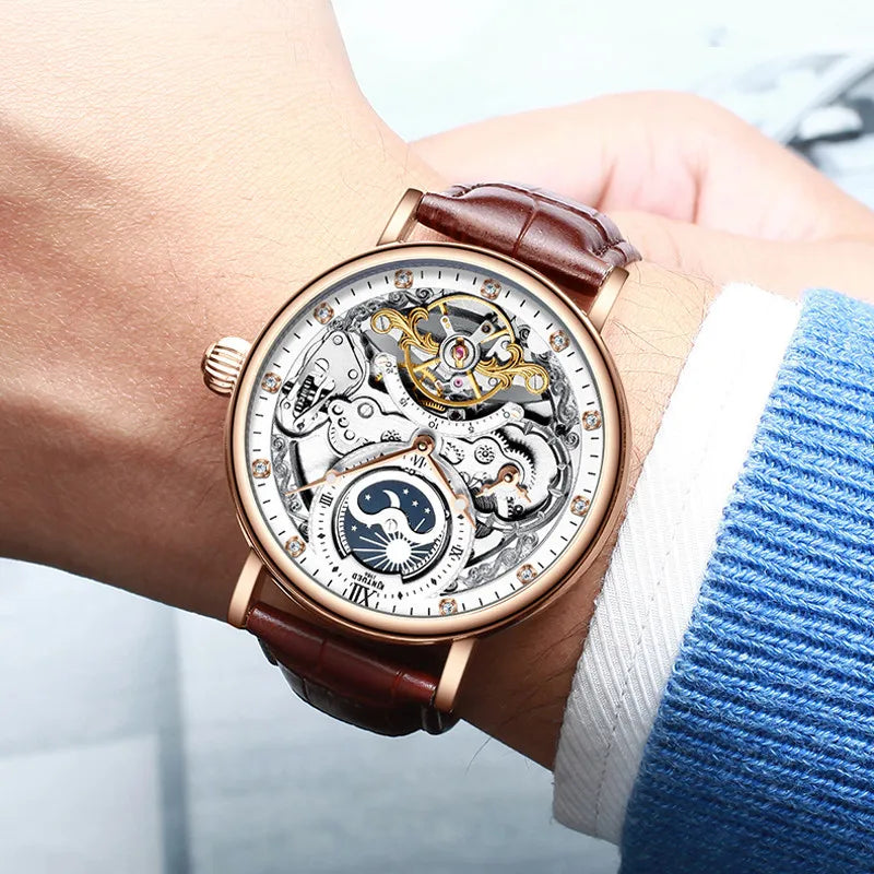 Orologio da uomo KINYUED – Modello di lusso, stile scheletrato con tourbillon, movimento meccanico a carica automatica, cassa color oro rosa, impermeabile.